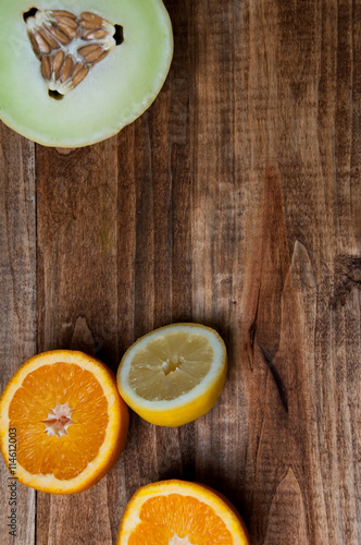 Fresh juicy fruits on a wooden background