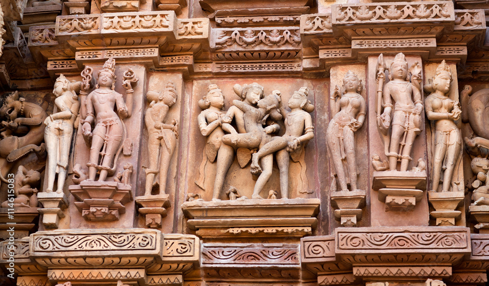Sculpture of lovers at the temple in Khajuraho, India