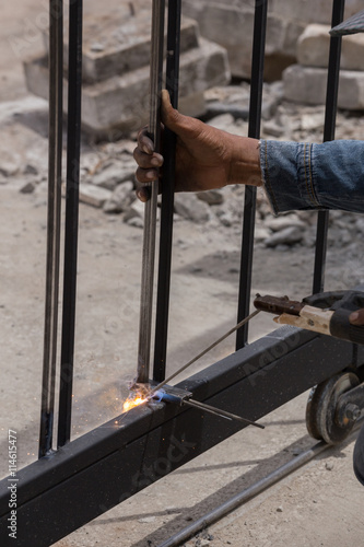 worker welding door frames