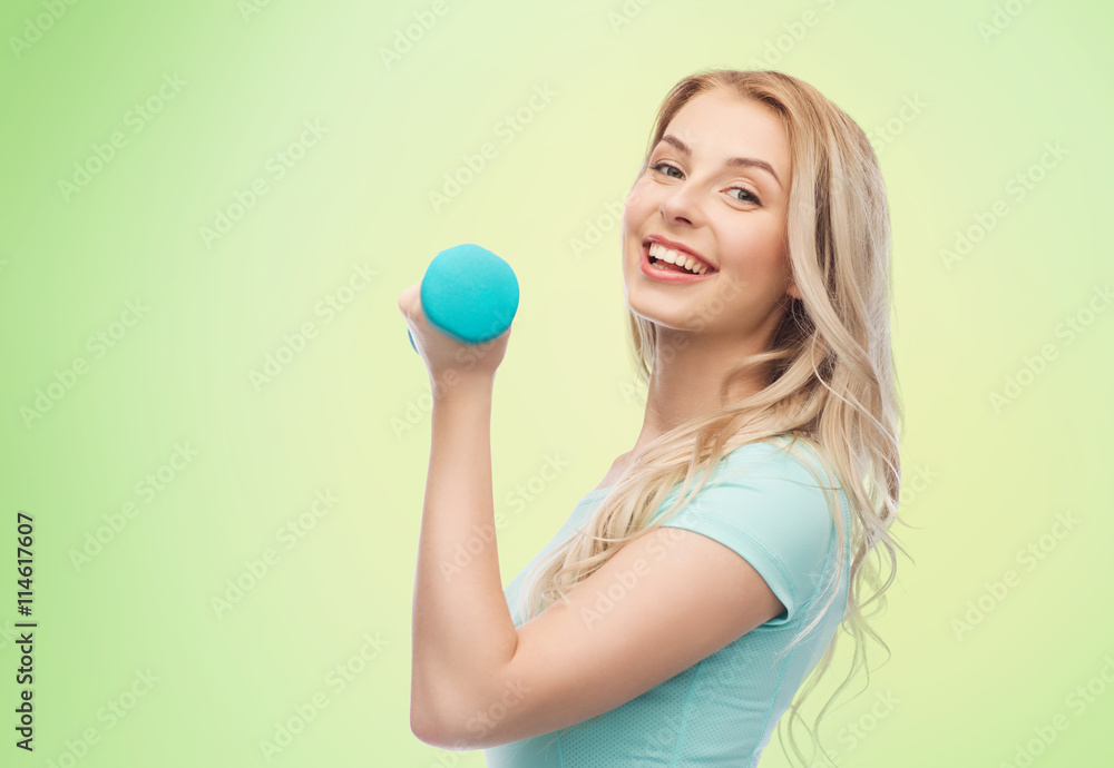 smiling beautiful young sporty woman with dumbbell smiling beautiful young sporty woman with dumbbell