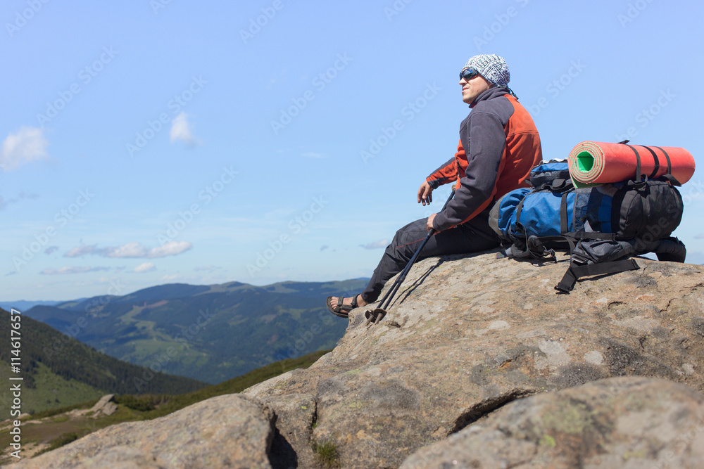 Fototapeta premium Hiking in the mountains in the summer on a sunny day.