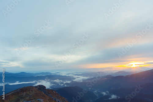 A beautiful sunrise in the clouds in the high mountains.