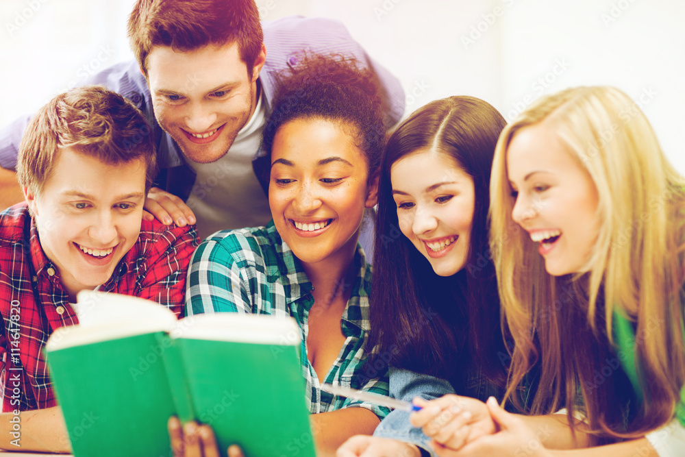 students reading book at school students reading book at school