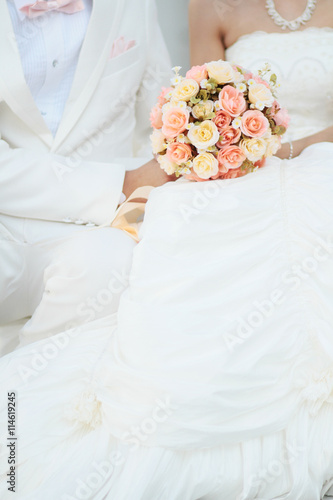 groom and bride with bouquet