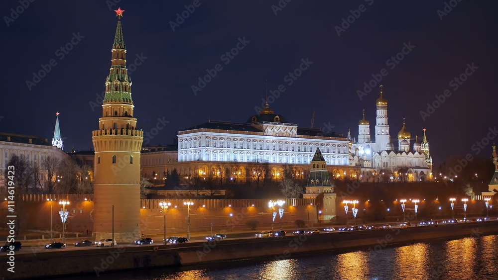 cars are moving on Moscow river embankment near Kremlin wall