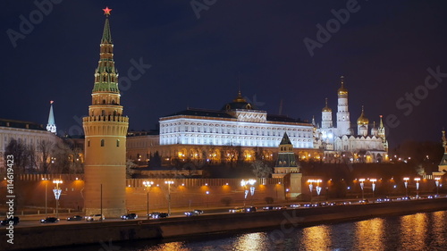 cars are moving on Moscow river embankment near Kremlin wall