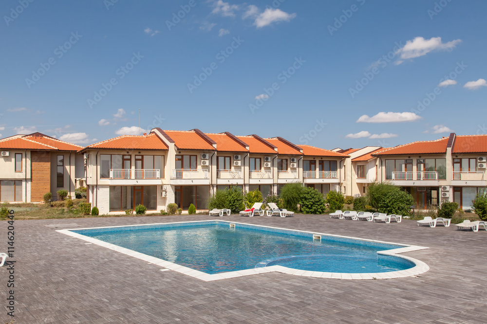 New suburban houses with swimming pool. Perfect neighborhood