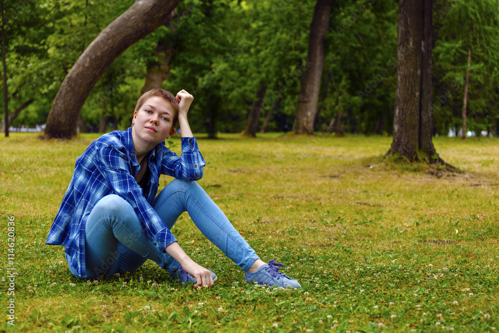 The girl with short hair in the garden The girl with short hair in the garden