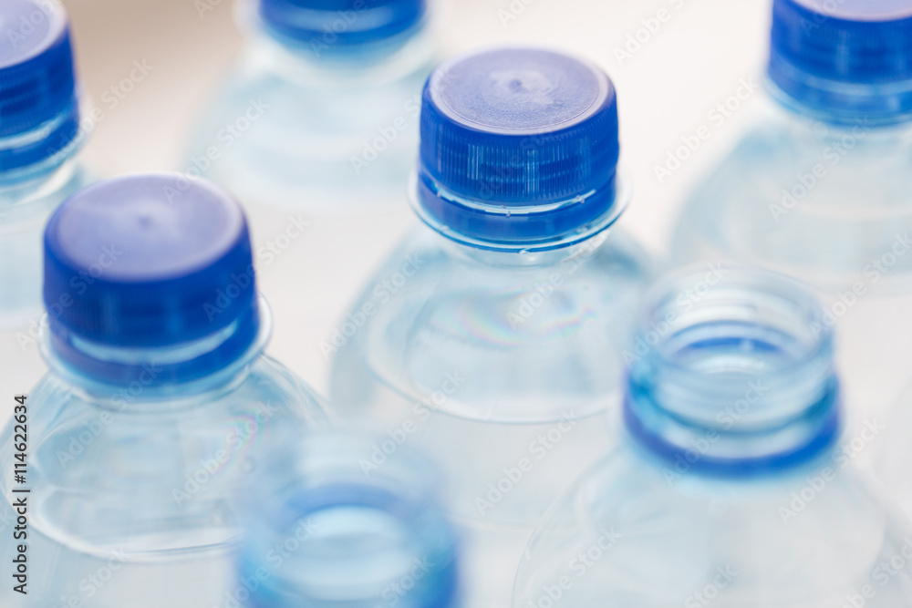 close up of plastic bottles with drinking water close up of plastic bottles with drinking water