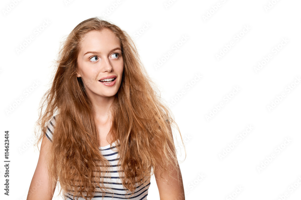 Excited teen girl looking to the side in amazement. Excited teen girl looking to the side in amazement.