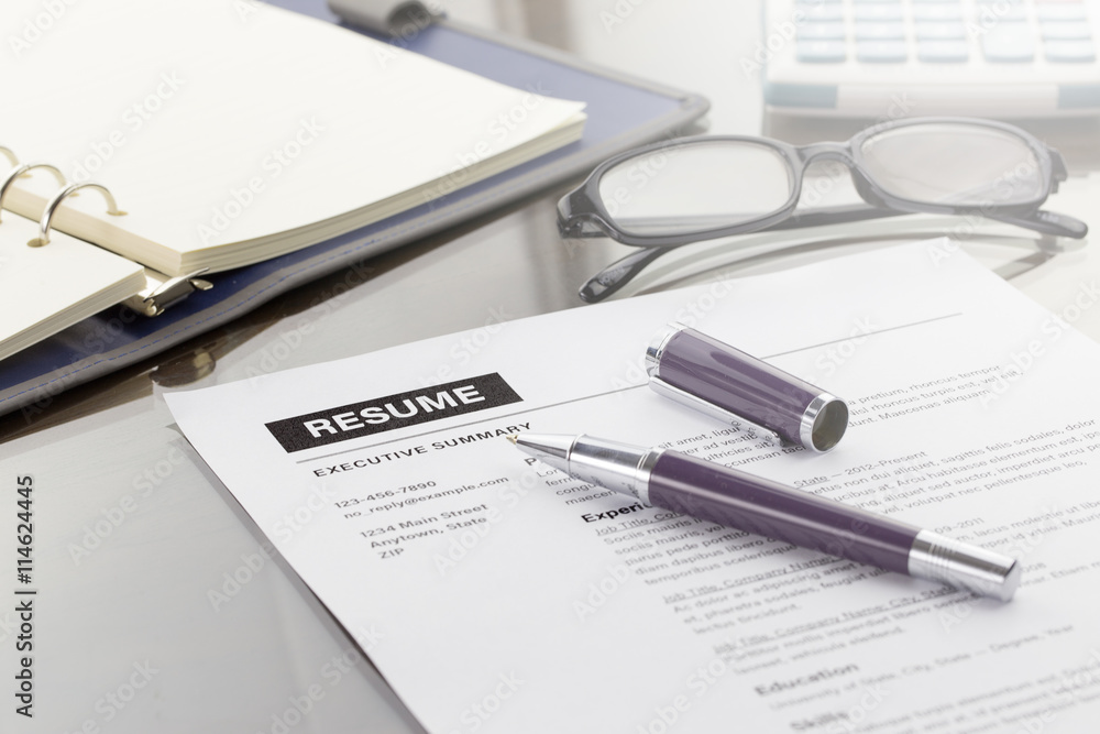 Resume information, pen, digital tablet, notebook, and glasses. Resume information, pen, digital tablet, notebook, and glasses.