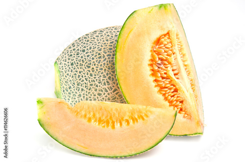 Cucumis melo or melon with half and seeds on wooden plate (Other