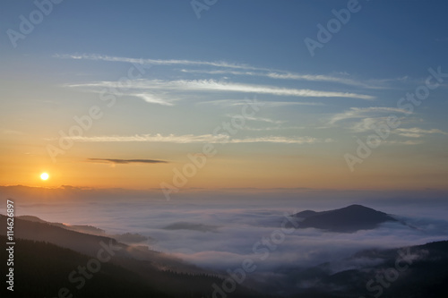 Beautiful foggy landscape sunrise in Carpathian mountains, Ukrai photo