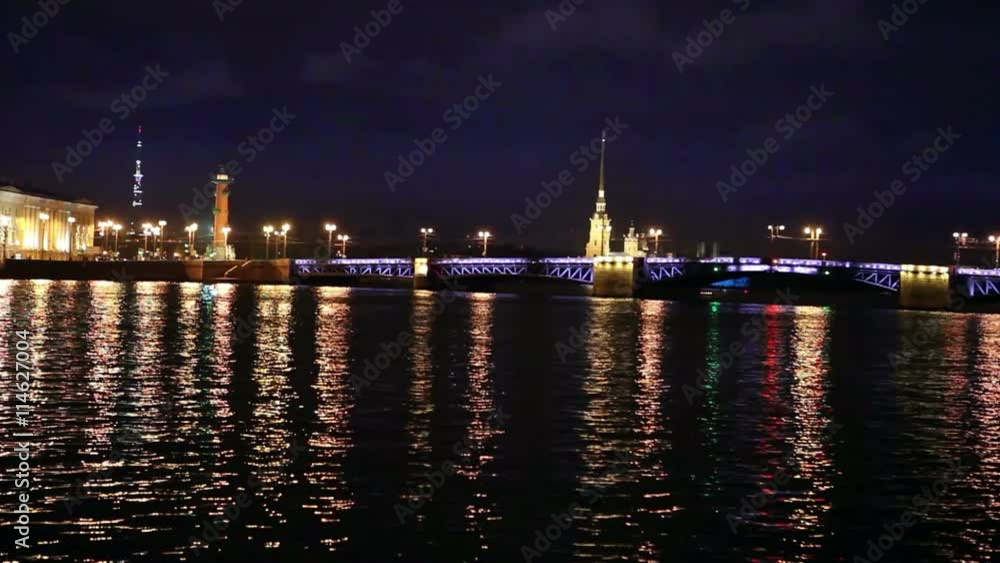 Night view of the University embankment of St. Petersburg through the Neva River- Peter and Paul fortress Palace bridge Vasilievsky island. Night view of the University embankment of St. Petersburg through the Neva River- Peter and Paul fortress Palace bridge Vasilievsky island.