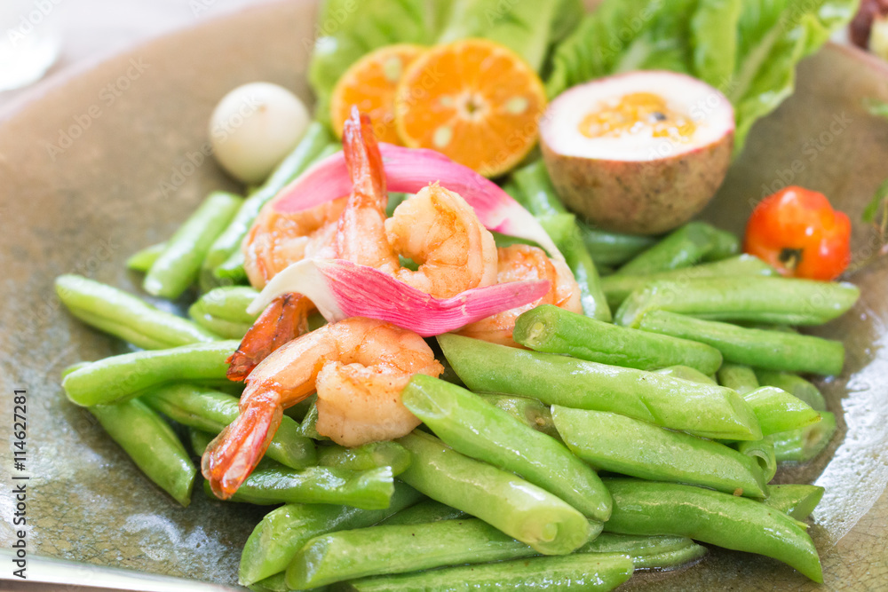Fried long beans with prawns with slices of orange and passion Fried long beans with prawns with slices of orange and passion