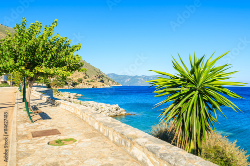 Promenade along a beautiful sea on coast of Kefalonia island in Agia Efimia, Greece