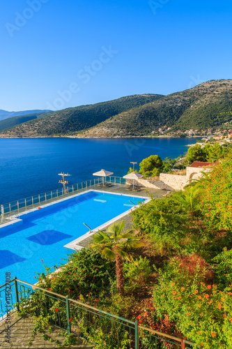 Swimming pool with sea and mountain view on coast of Kefalonia island in Agia Efimia village, Greece