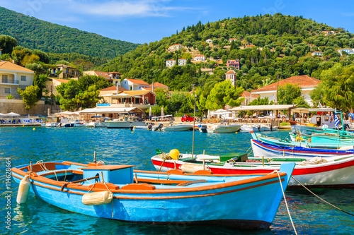 Colorful Greek fishing boats in port of Kioni on Ithaka island, Greece photo
