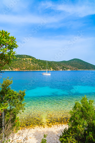 Yacht boat in beautiful bay with Antisamos beach on Kefalonia island, Greece