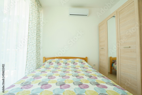 Interior of a lbedroom in a guest house photo