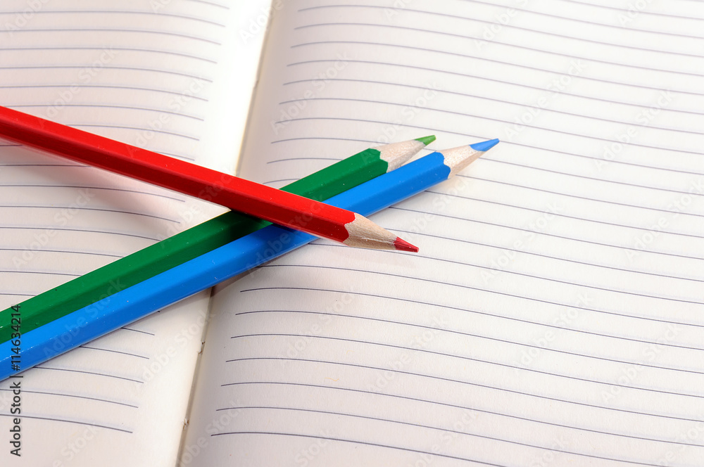 Blank notebook with color pencil. Education concept. Blank notebook with color pencil. Education concept.