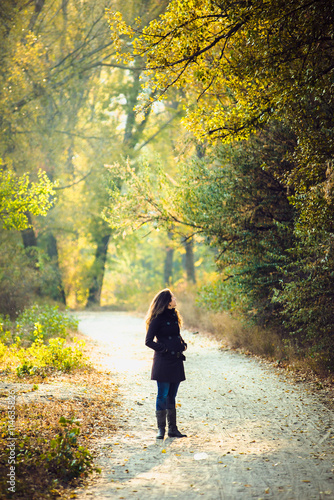 girl walks in beautiful autumn park © sushytska