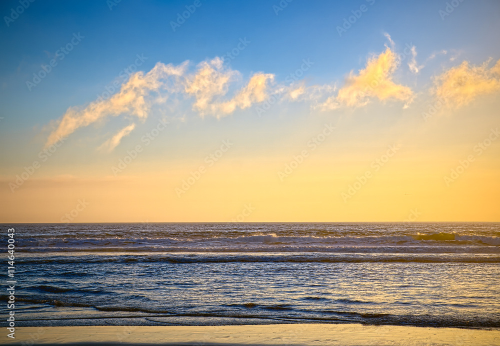 California beach sunset with clouds and blue sky.  California USA.