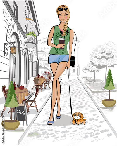Fashion young girl drinking coffee in the street of old city.
