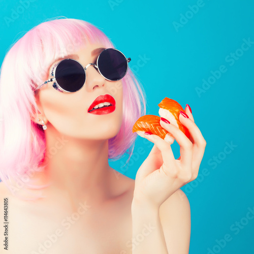 Beautiful girl with red lips and pink hair