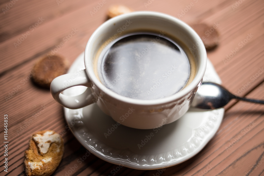 coffee americano with beans on wooden table coffee americano with beans on wooden table