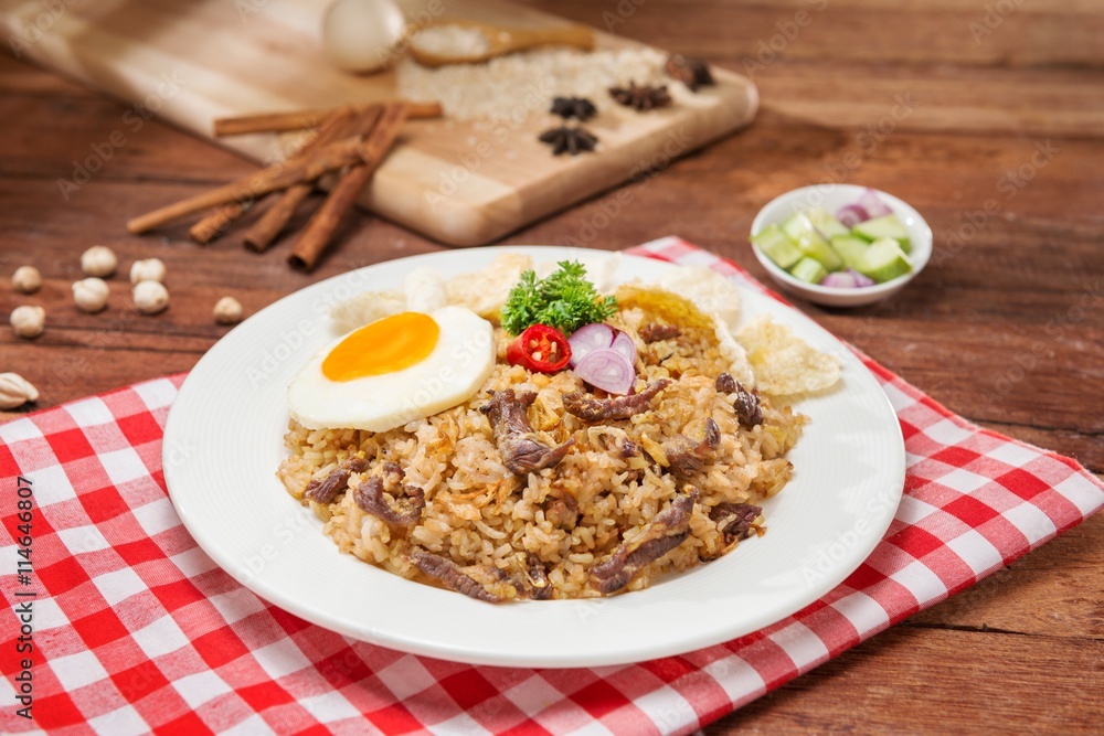 Fried rice with dried beef and egg on the table Fried rice with dried beef and egg on the table