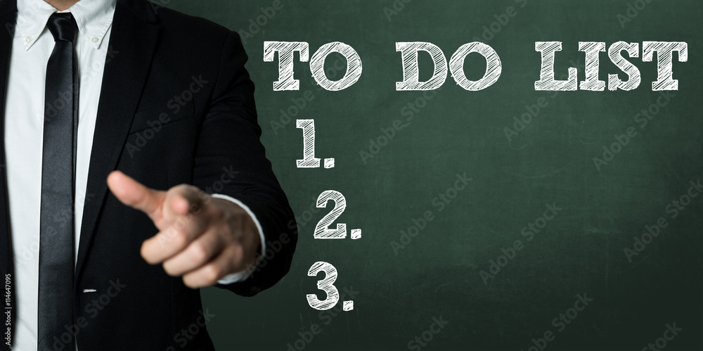 Business man pointing with the text: To Do List Business man pointing with the text: To Do List