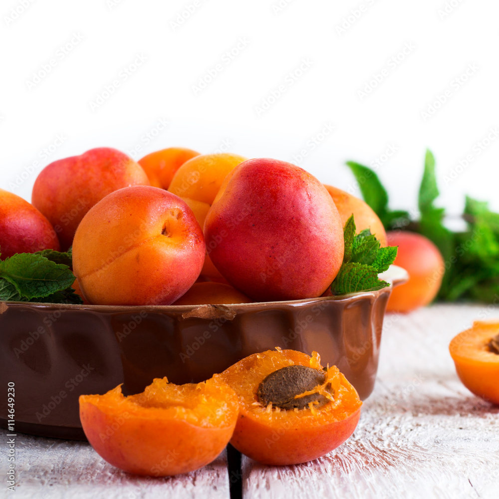Ceramic bowl with organic ripe apricots Ceramic bowl with organic ripe apricots