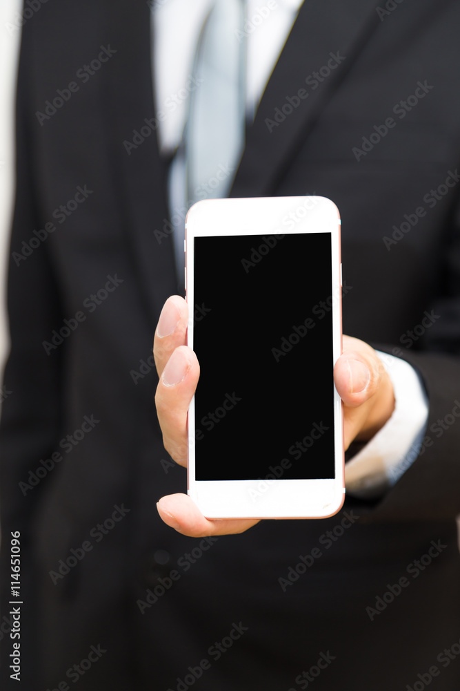 Man holding mobile smartphone in to camera. Man holding mobile smartphone in to camera.