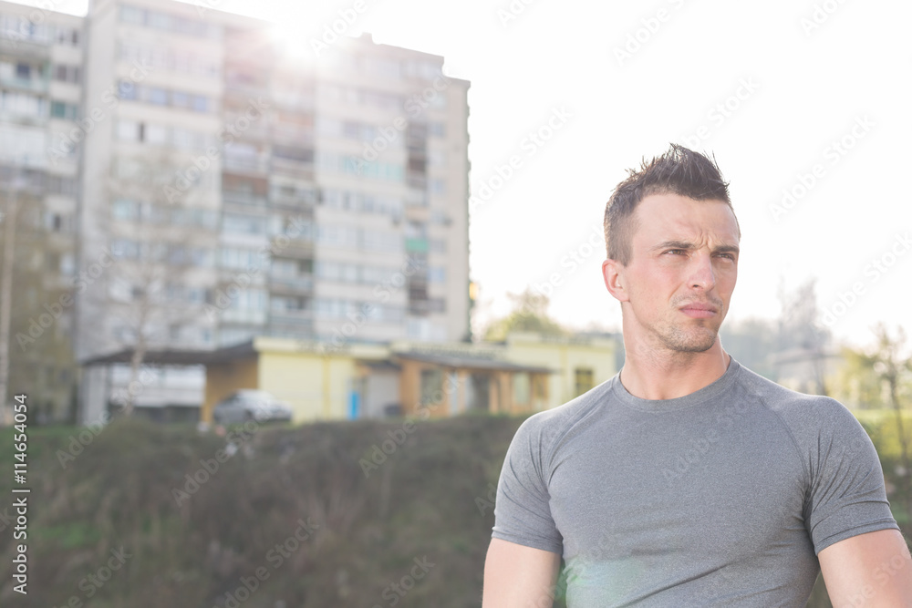 portrait of handsome jogging man while relaxing and take break a portrait of handsome jogging man while relaxing and take break a