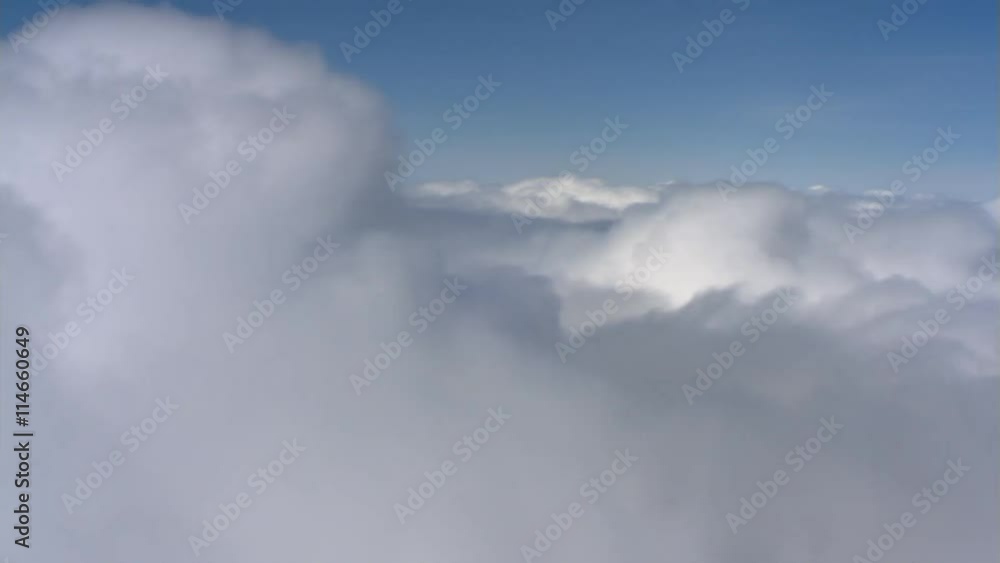 Flying past top of white cloud bank, passenger POV Flying past top of white cloud bank, passenger POV