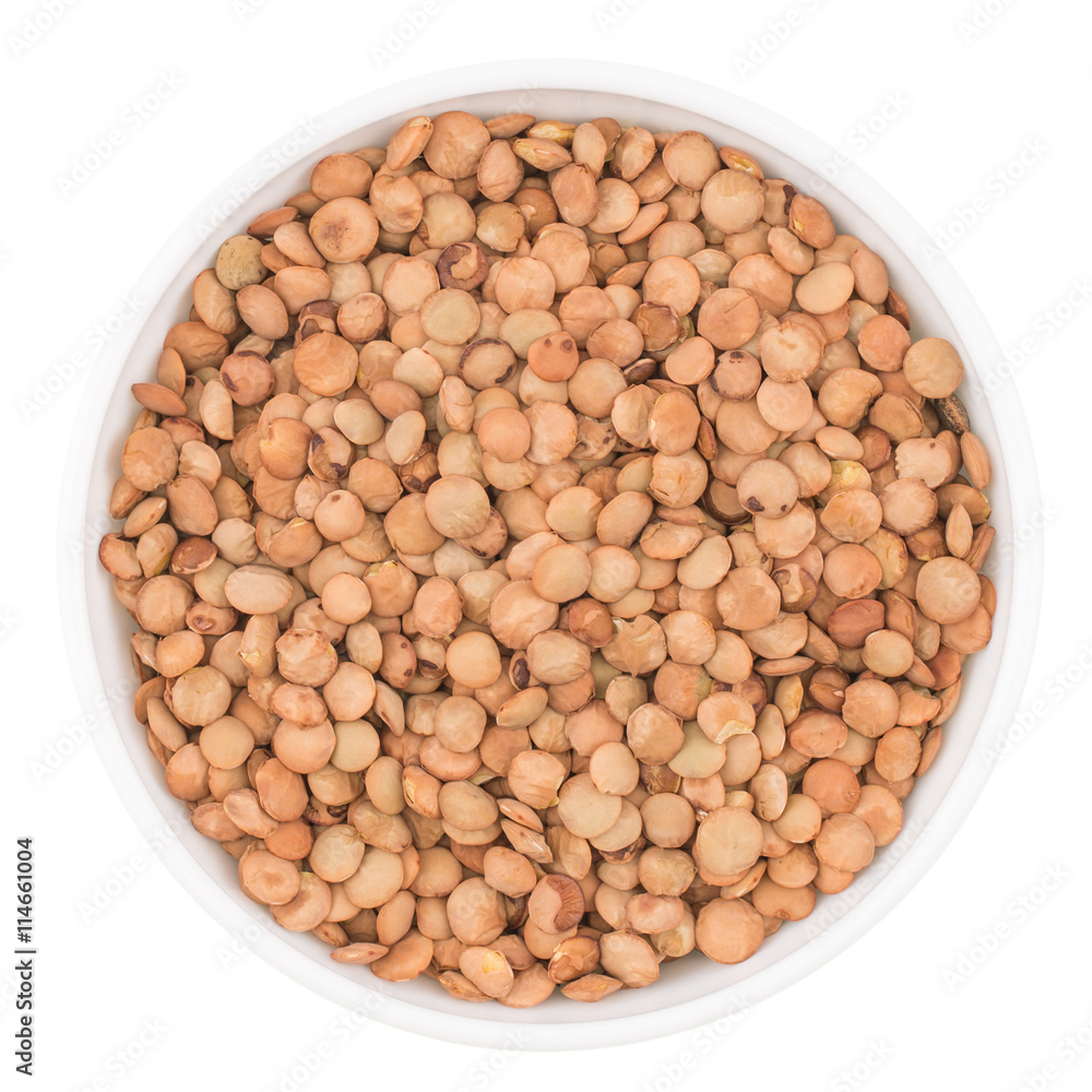 White ceramic bowl of green uncooked lentils isolated on white f White ceramic bowl of green uncooked lentils isolated on white f