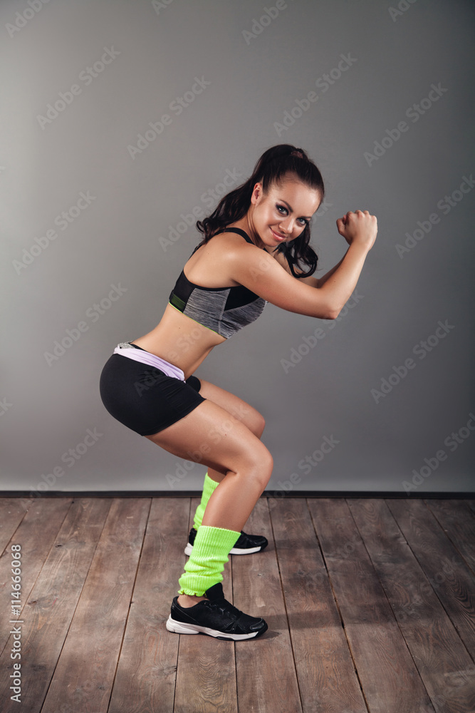 Beautiful fitness girl in sportwear exercising