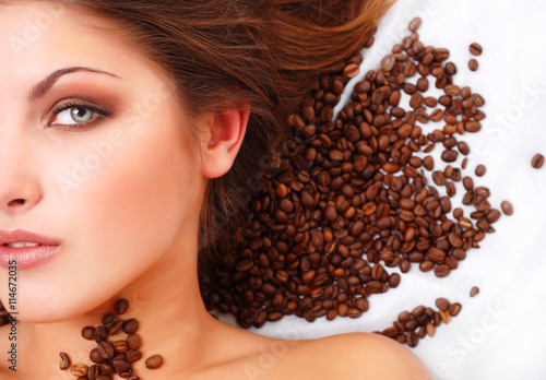 woman's face with coffee  beans