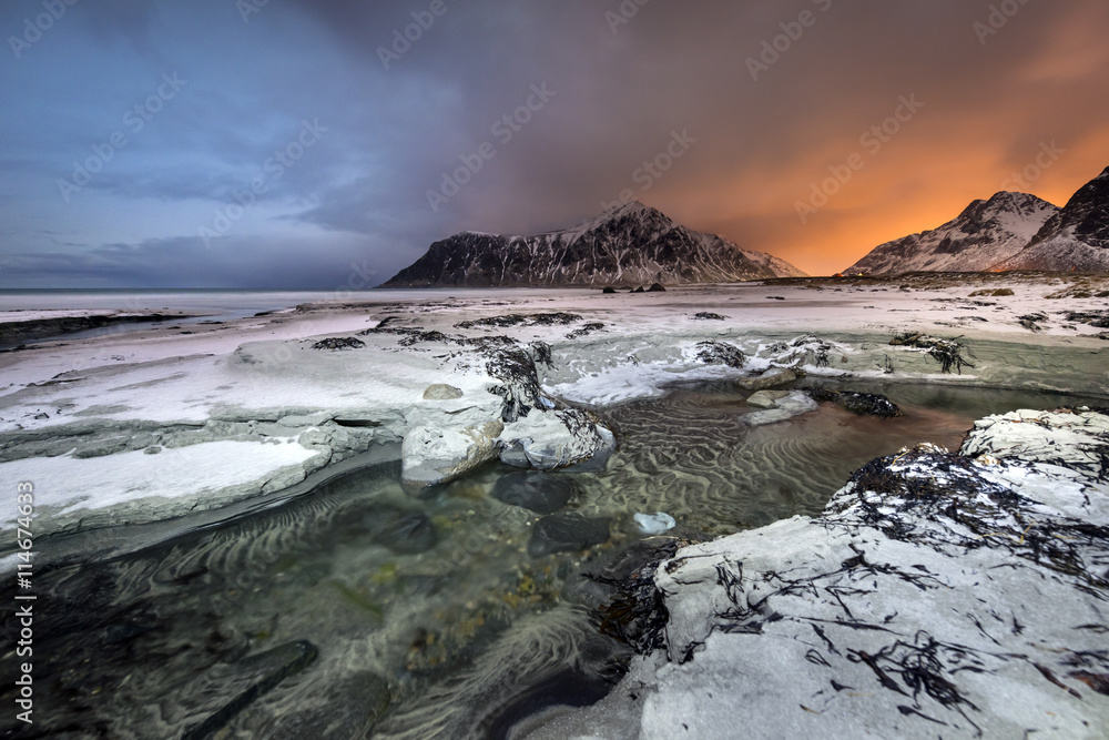 Fototapeta premium Sundown over Skagsanden Beach in the winter on the Lofoten Islan