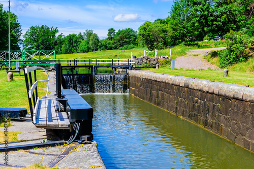 Narrow canal with closed canal lock at the end. Gota canal in Sweden.