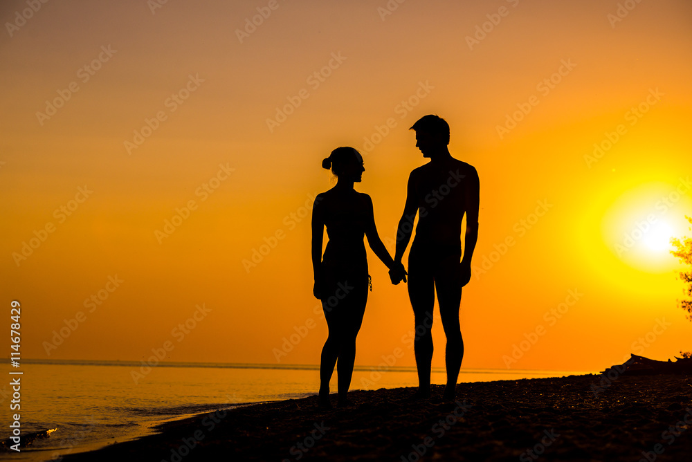Couple of lover holding hand with sunrise