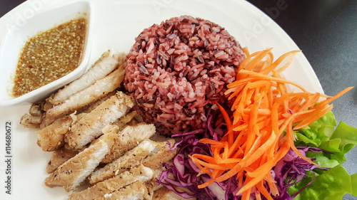 A baked pork with rice and teriyaki sauce
