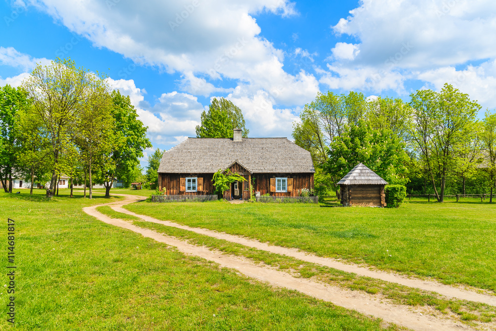Rural road in Tokarnia village on sunny beautiful spring day, Poland Rural road in Tokarnia village on sunny beautiful spring day, Poland