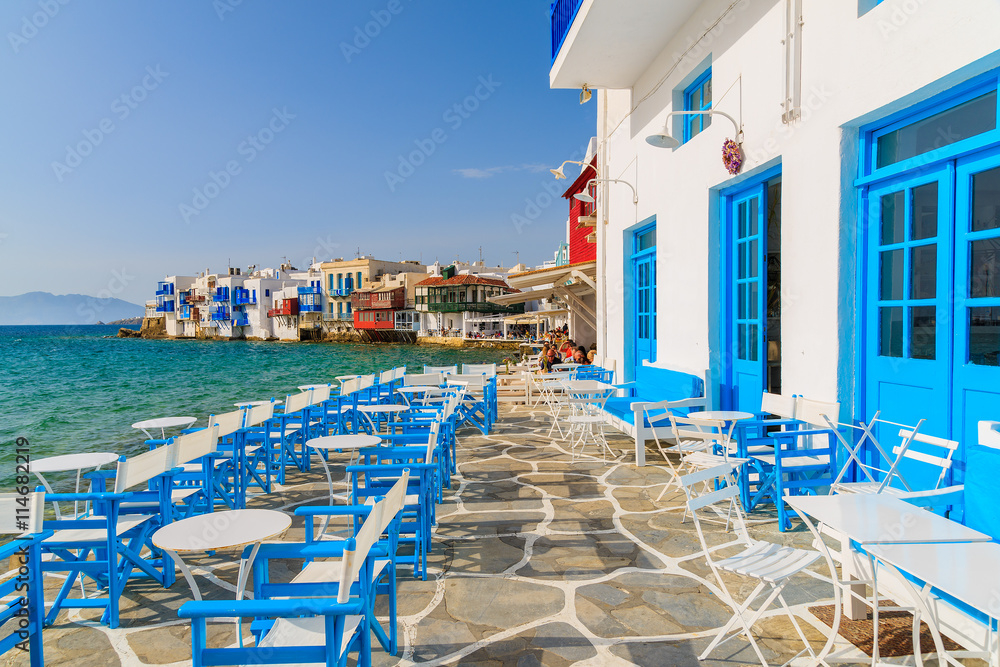 A view of restaurant in Little Venice part of Mykonos town, Mykonos island, Greece - obrazy, fototapety, plakaty 