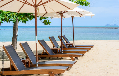 Beach chairs on the beach with blue sky Koh Samui in Thailand