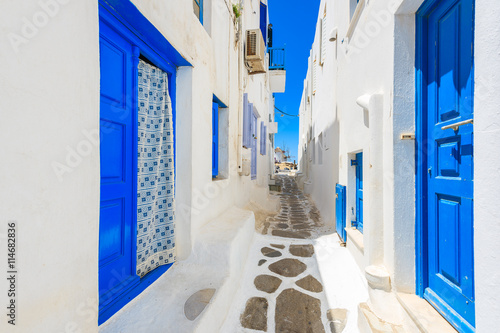 A view of whitewashed street with blue doors in Mykonos town, Cyclades islands, Greece © pkazmierczak