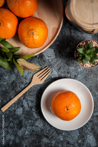 Fresh orange fruits and juice on marble table. Flat lay.