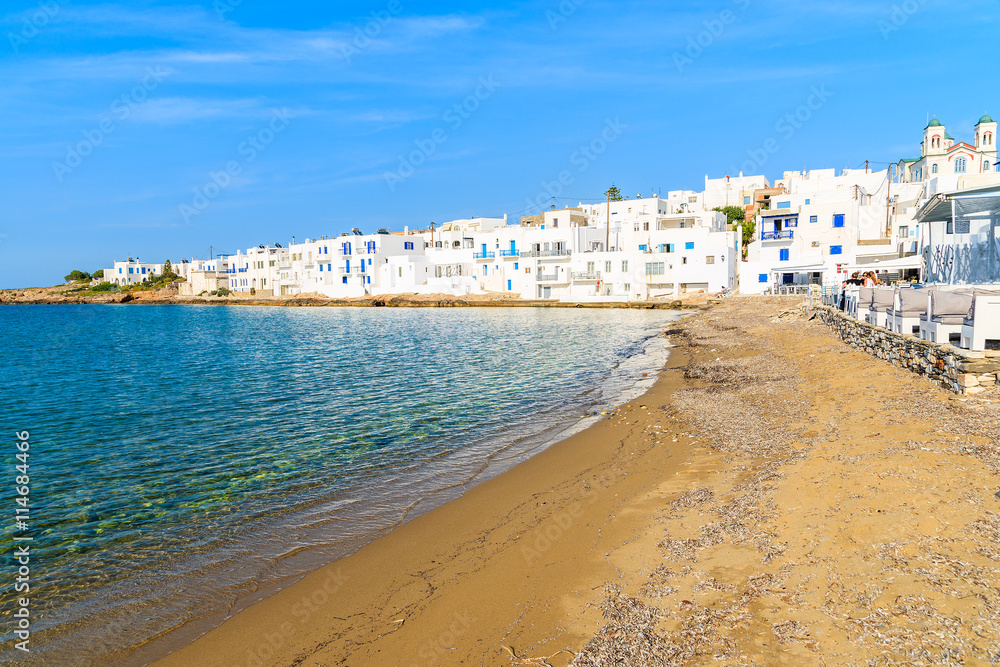 A coastal promenade in Naoussa port with traditional white Greek architecture, Paros island, Cyclades, Greece