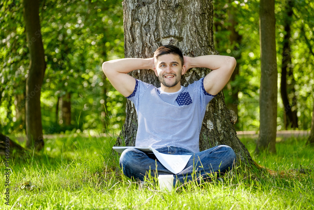 Man with coffee in park Man with coffee in park